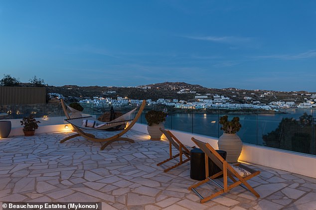 The villa is set in a sprawling 5,382 square foot private compound, overlooking the beach and the Aegean Sea